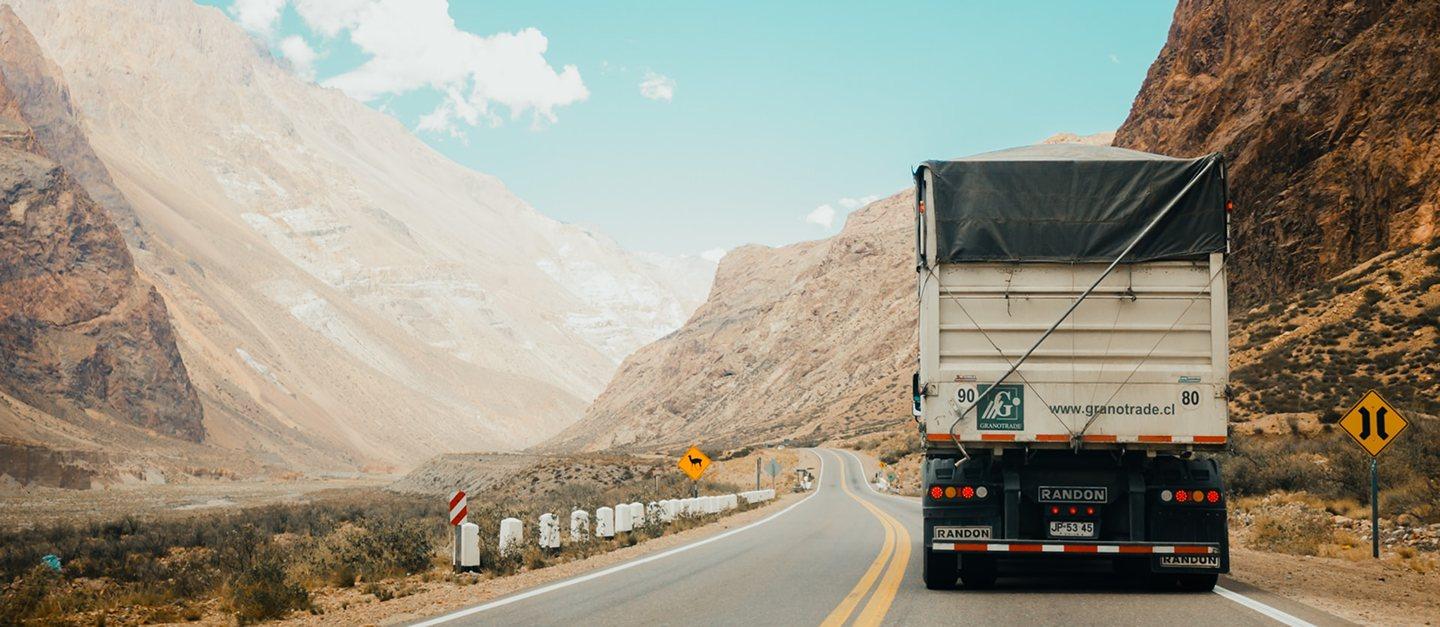 A truck driving through a mountain pass.
