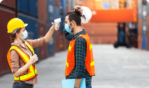 Two dock workers checking in at a container yard.